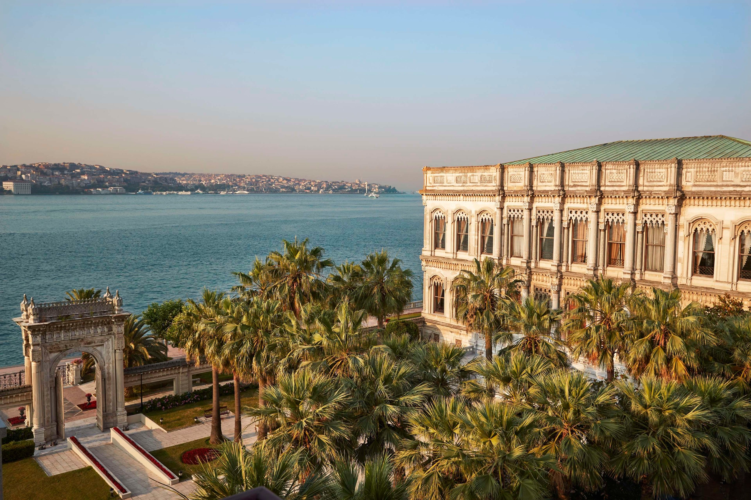 The palace on the Bosphorus shore among palm trees, Çırağan Palace Kempinski Istanbul