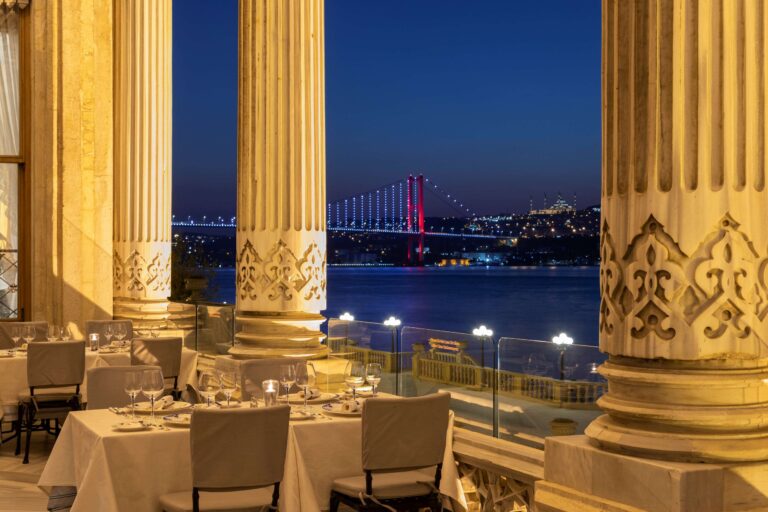 Restaurant terrace looking to the Bosphorus Bridge at night, Çırağan Palace Kempinski Istanbul