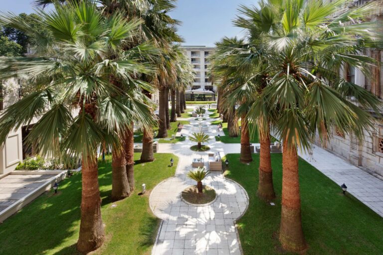 Garden path and fountain between the palms, Çırağan Palace Kempinski Istanbul