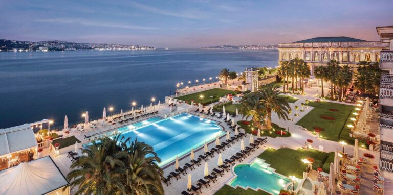 Outdoor pool and the palace on the Bosphorus at dusk, Çırağan Palace Kempinski Istanbul