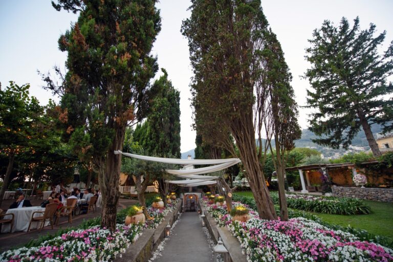 A formal garden laid for dinner, cypresses and flower beds down either side, Ramona Avitabile Wedding Planner
