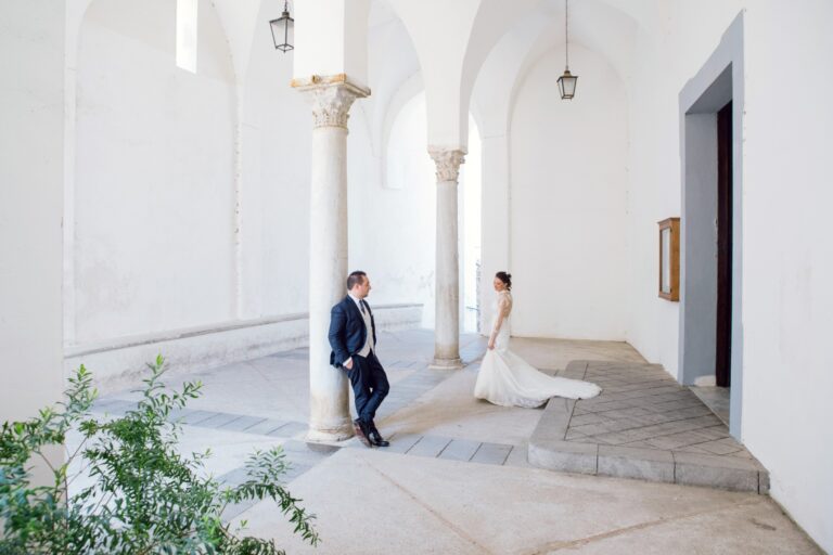 The couple apart in a white arcade, one column standing between them, Ramona Avitabile Wedding Planner