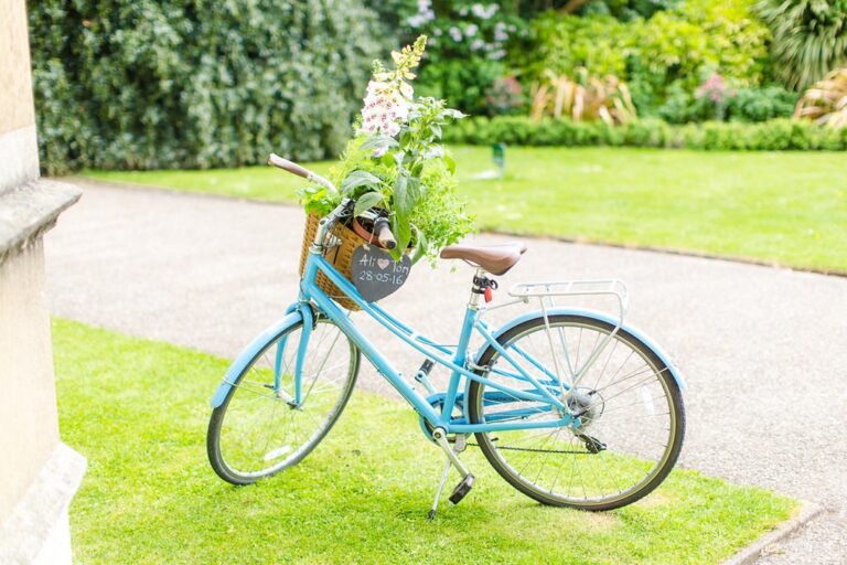 A decorated bicycle with foxgloves, for Al and Tom's wedding. Photograph by Eddie Judd Photography, Rebecca Mays