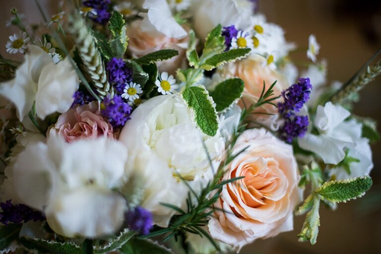 A bouquet detail in peach rose, white peony and daisy, Rebecca Mays
