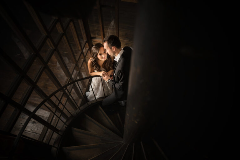 Couple on a spiral staircase in low light, Reflexion Studio
