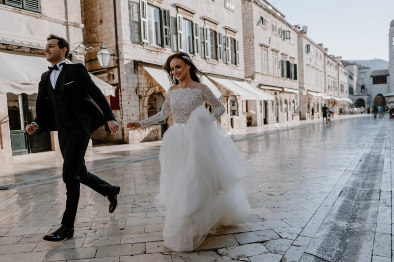 Couple running down the Stradun, Dubrovnik, Reflexion Studio