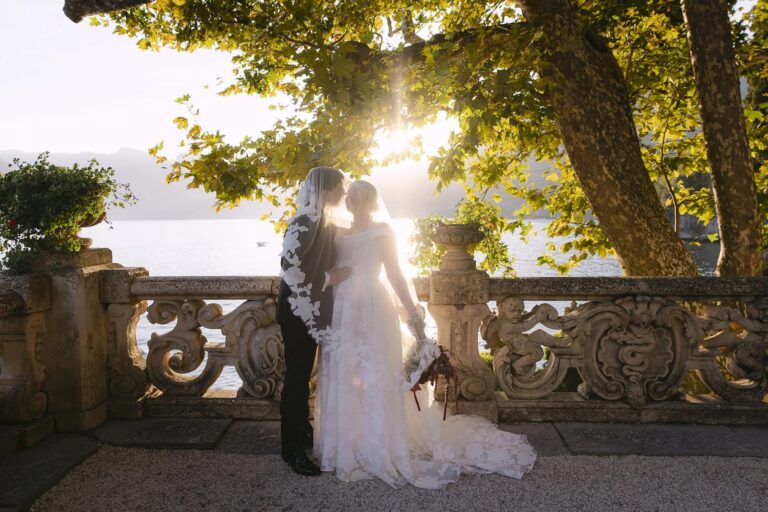 A couple on the balustraded terrace of Villa del Balbianello against the evening light, Lake Como, Rellini Art Studio