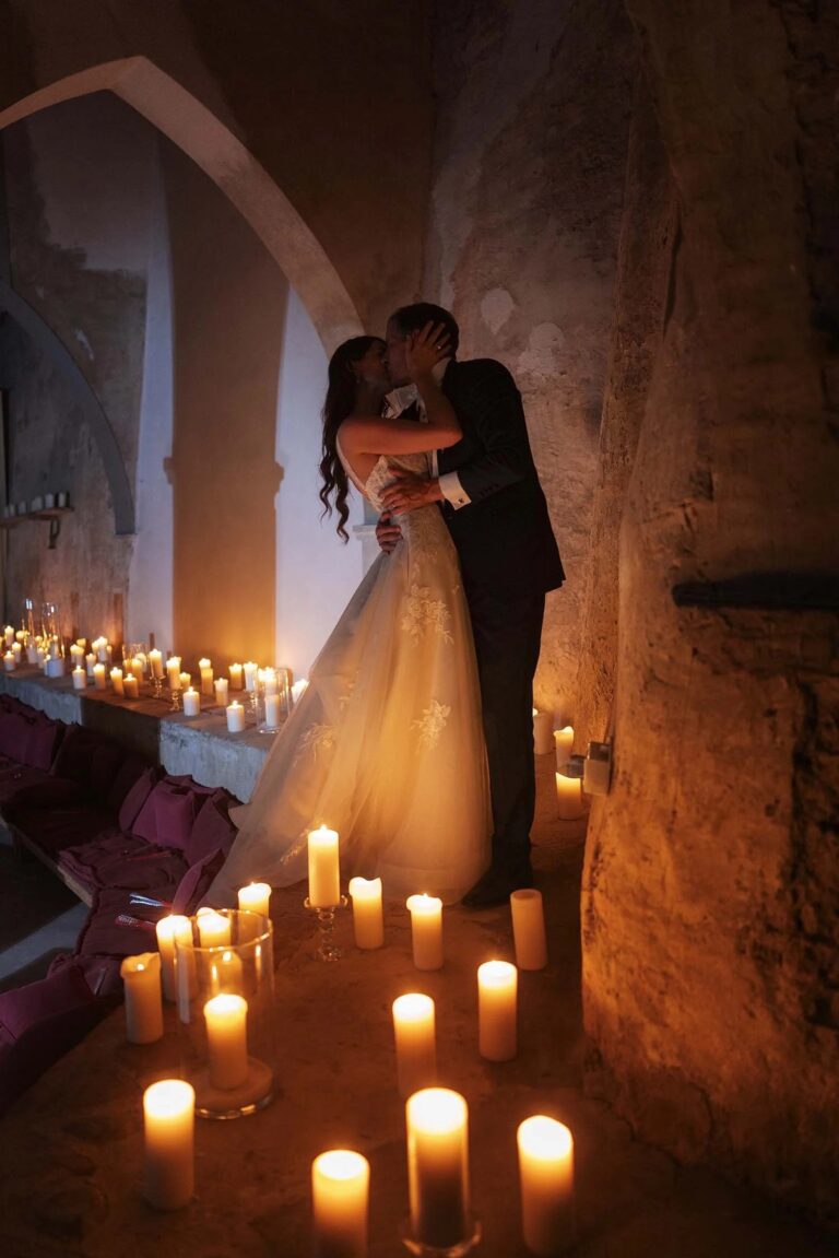 A kiss by candlelight in a stone passage at Castello di Montegufoni, Tuscany, Rellini Art Studio