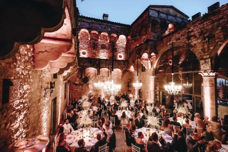 Wedding dinner in the lantern-lit courtyard of Castello di Vincigliata near Florence, Rellini Art Studio
