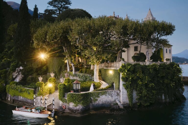 Villa del Balbianello lit at night on its promontory, Lake Como, Rellini Art Studio