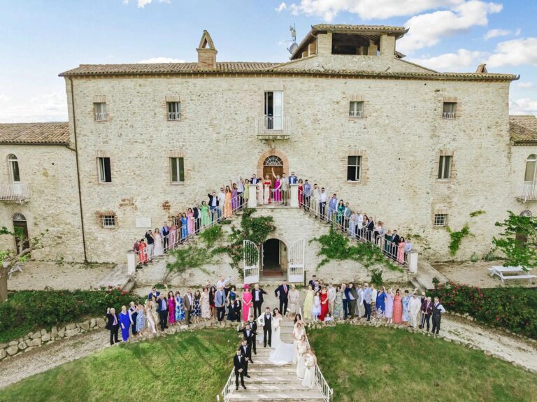 Guests gathered on the steps in front of Castello di Montignano, Umbria, Rellini Art Studio