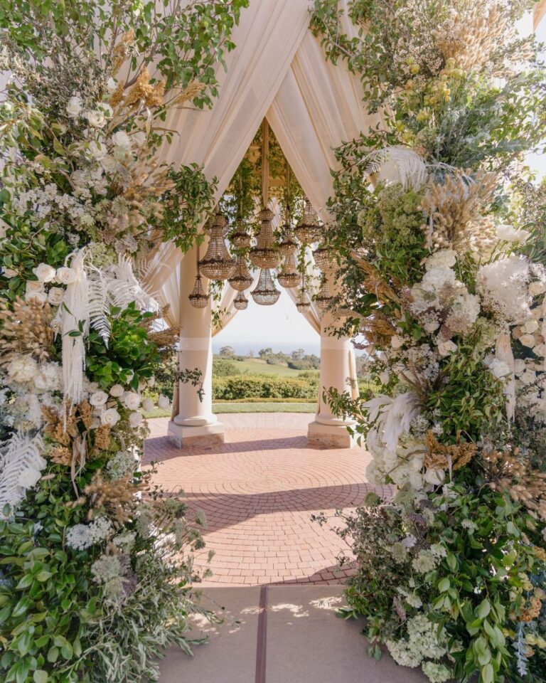 Floral arch and draping framing the ocean view at the ceremony, Pelican Hill, Revelry Event Designers