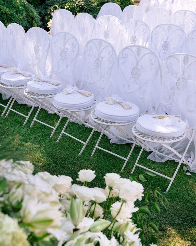 Scalloped ceremony chairs on the lawn, Malibu, Revelry Event Designers