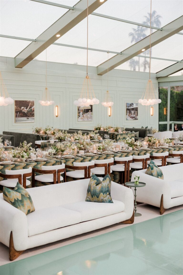 Lounge seating and framed artwork inside the glass pavilion, Palm Springs, Revelry Event Designers