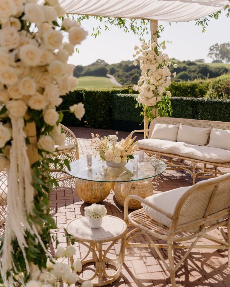 Cocktail lounge with rattan seating and floral columns, Pelican Hill, Revelry Event Designers