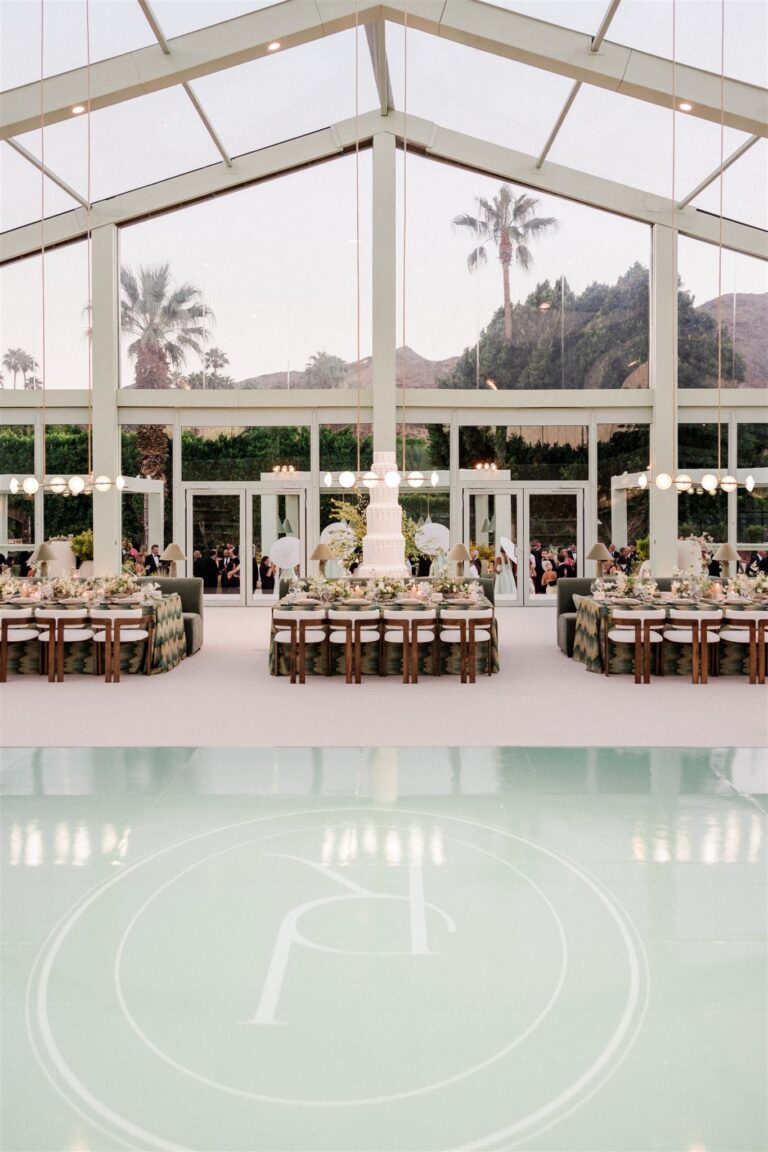 Pavilion entrance and monogrammed dance floor at dusk, Palm Springs, Revelry Event Designers