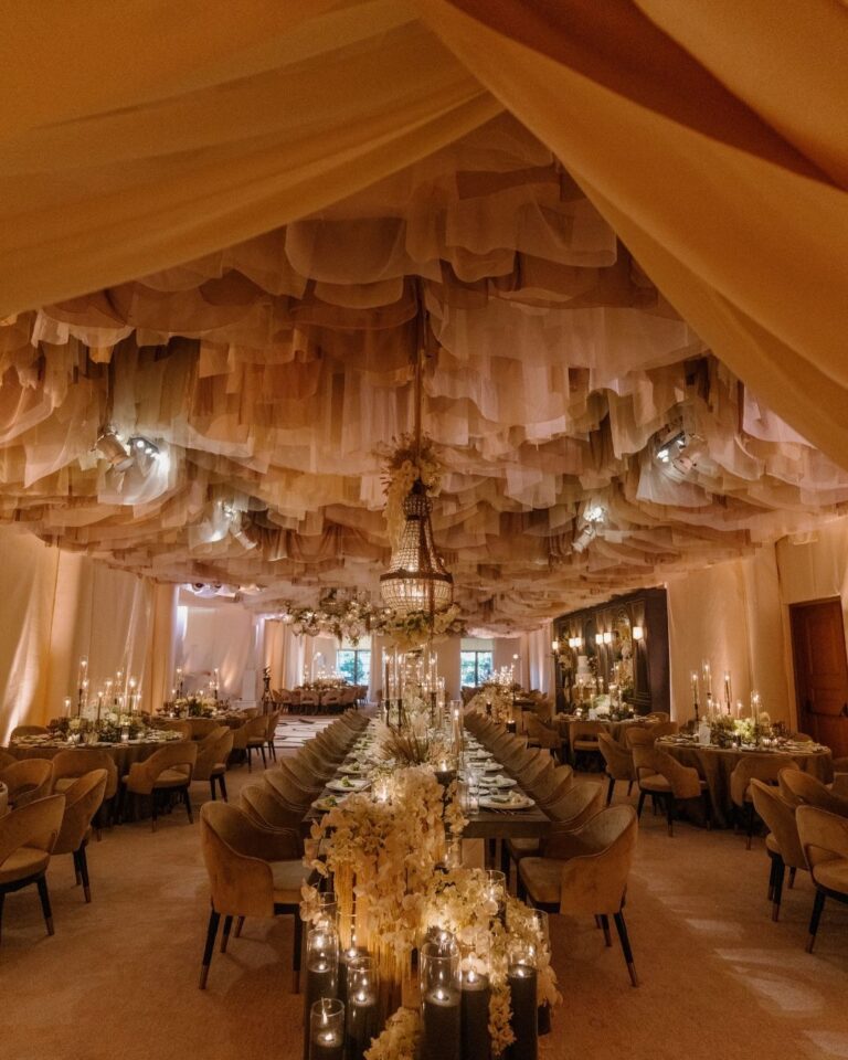 Long reception tables beneath a fabric canopy, Pelican Hill, Revelry Event Designers