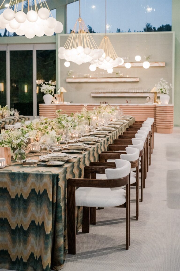 Long banquet table with patterned linens and globe pendants, Palm Springs, Revelry Event Designers