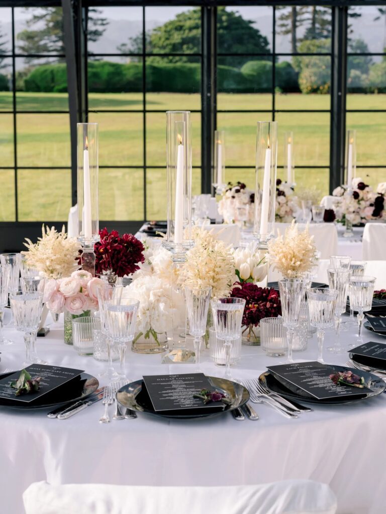 Round reception table with tall candles and florals, Santa Barbara, Revelry Event Designers