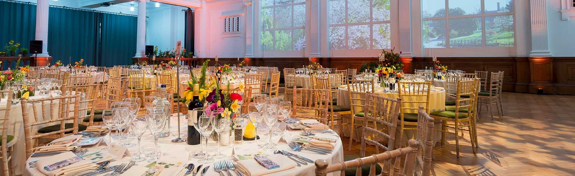 Round tables laid for a dinner in Lindley Hall, The Royal Horticultural Halls, Royal Horticultural Halls, lindley hall round tables