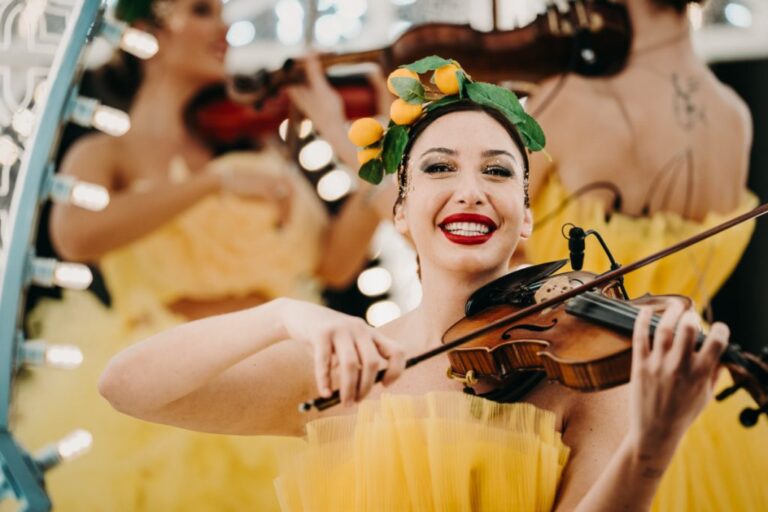 Smiling violinist in a yellow tulle dress, Rinaldi Production