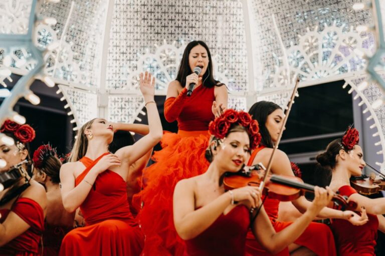Vocalist and string section performing in red, Rinaldi Production