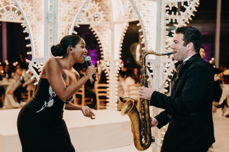 Vocalist and saxophonist performing together for dinner guests, Rinaldi Production