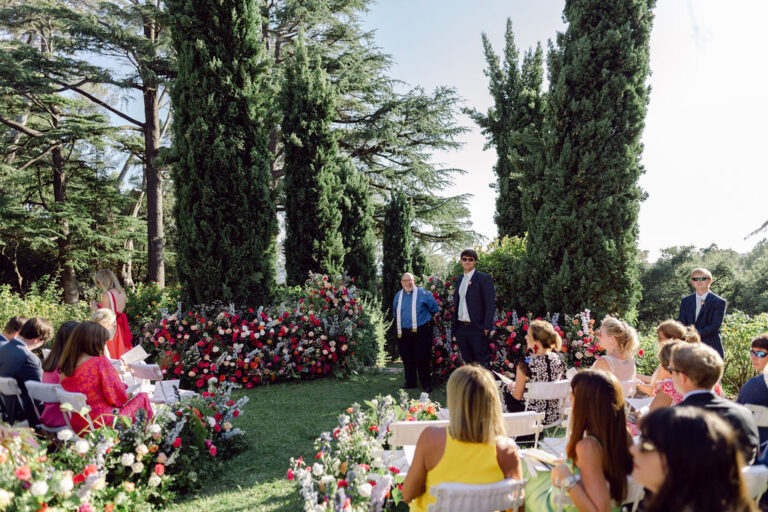 Guests at an outdoor garden ceremony, Rocabella