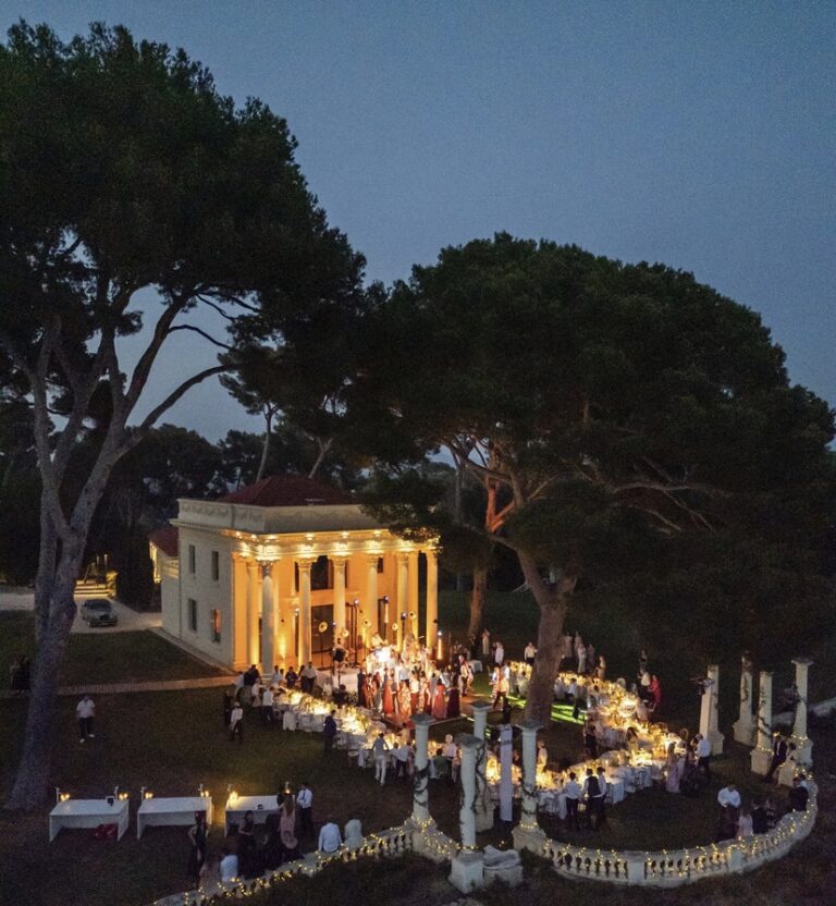 Le Temple lit up at night for a wedding celebration, Rocabella