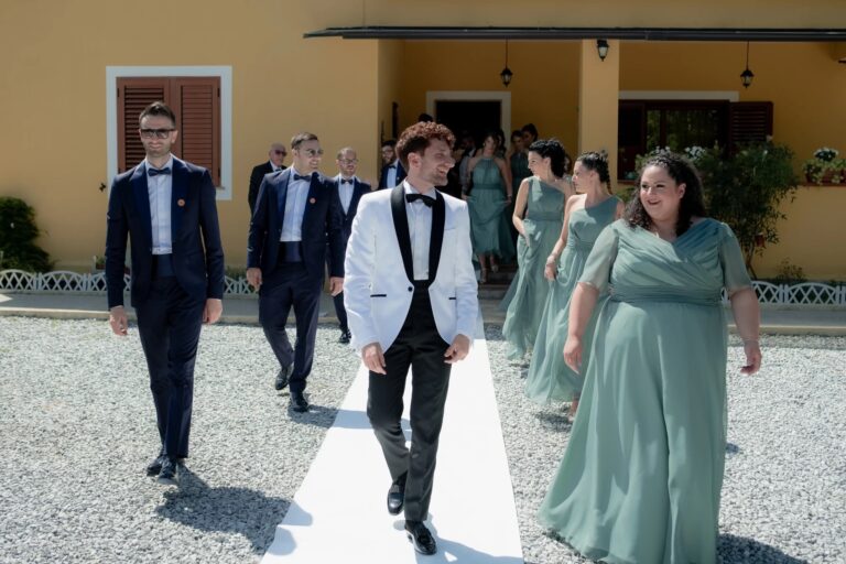 A groom walking out with the wedding party, Castello di Serragiumenta, Rocco Daniele Photography