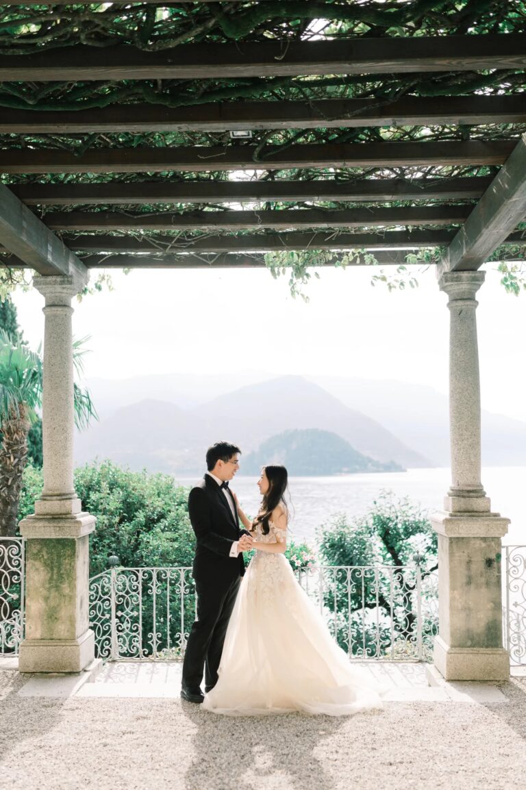 A portrait beneath a stone pergola, Lake Como below, Rocco Daniele Photography