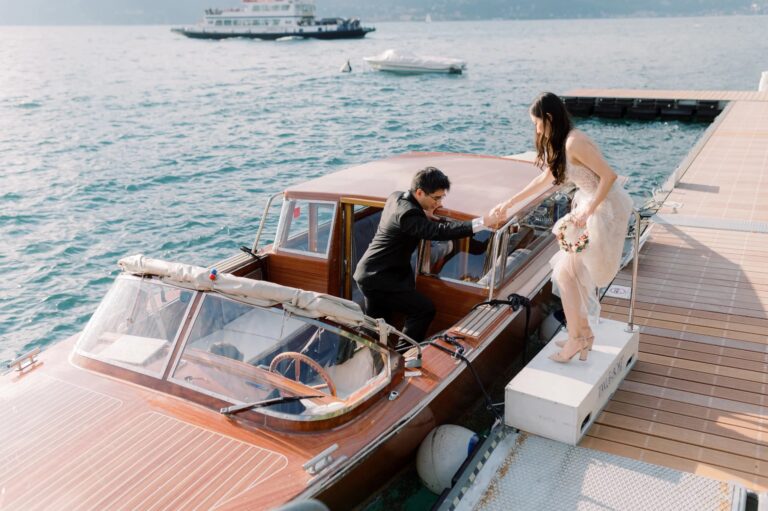 Stepping aboard a wooden boat at the jetty on Lake Como, Rocco Daniele Photography