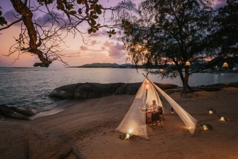 A private dinner for two in a canopy on the beach at sunset, Rocky’s Boutique Resort