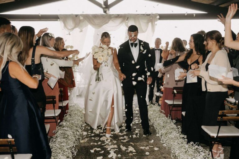 Recessional through a shower of petals under a covered terrace (Em & Callum), RoRas Destination Wedding
