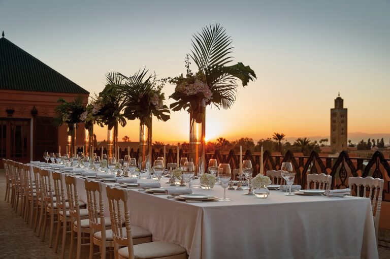 Long wedding table on the roof terrace at sunset, Royal Mansour Marrakech