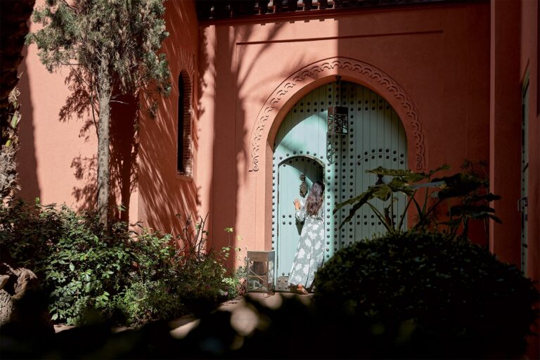 Doorway in the rose-coloured walls and garden, Royal Mansour Marrakech