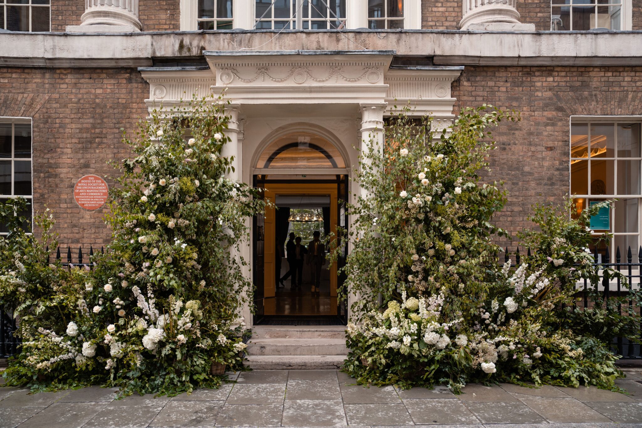 The Georgian entrance of RSA House dressed with floral arches, RSA House