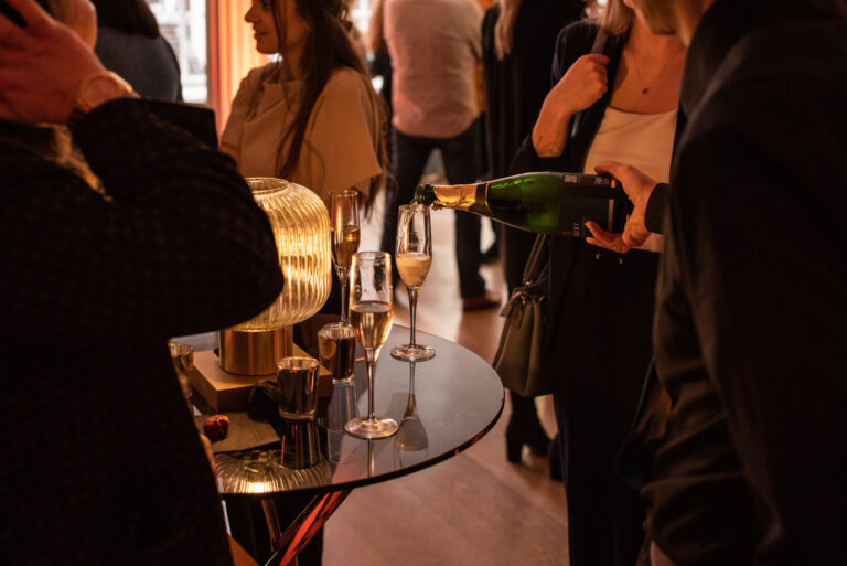 Champagne poured at a drinks reception, RSA House