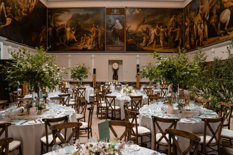Round tables set for a wedding breakfast in the Great Room, RSA House