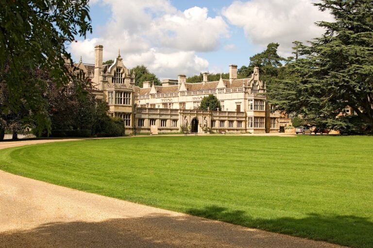 A Four-Poster Bedroom at Rushton Hall, Rushton Hall Hotel & Spa