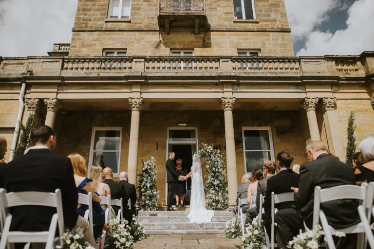 A ceremony on the veranda steps, Salomons Estate