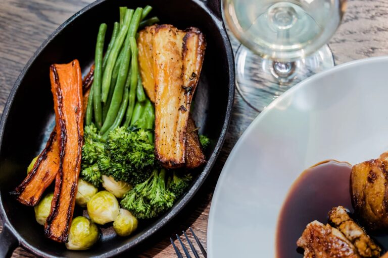 Roast vegetables and gravy served at the table, Salomons Estate