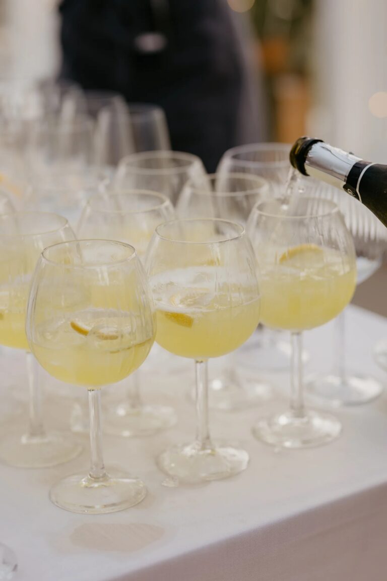 Glasses of Prosecco poured for a drinks reception, Salomons Estate
