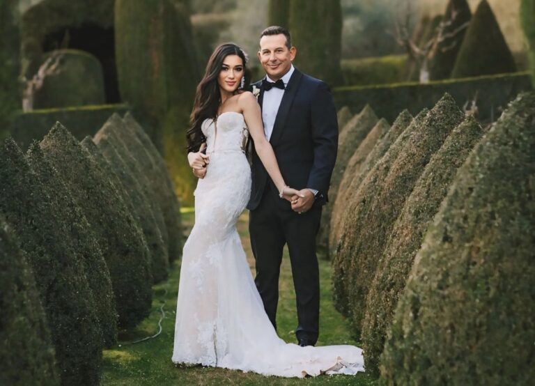 Bride and groom among clipped cypress hedges on the wedding day, Samantha Pretto