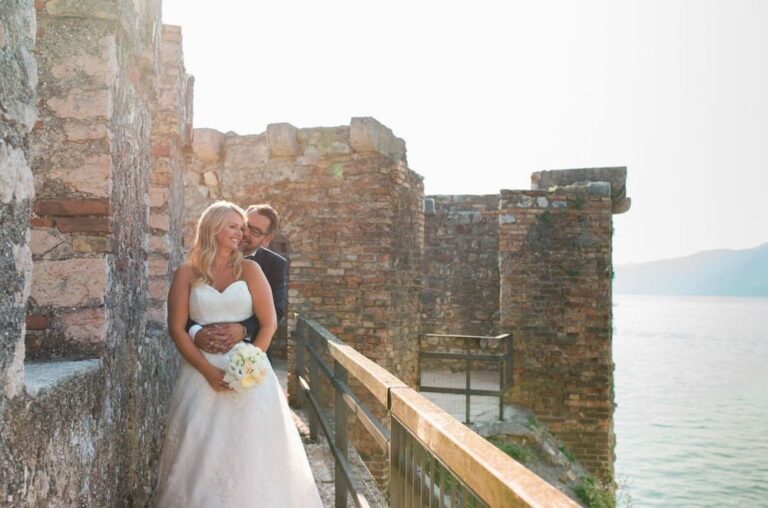 Bride on the battlements of a lakeside castle, Samantha Pretto