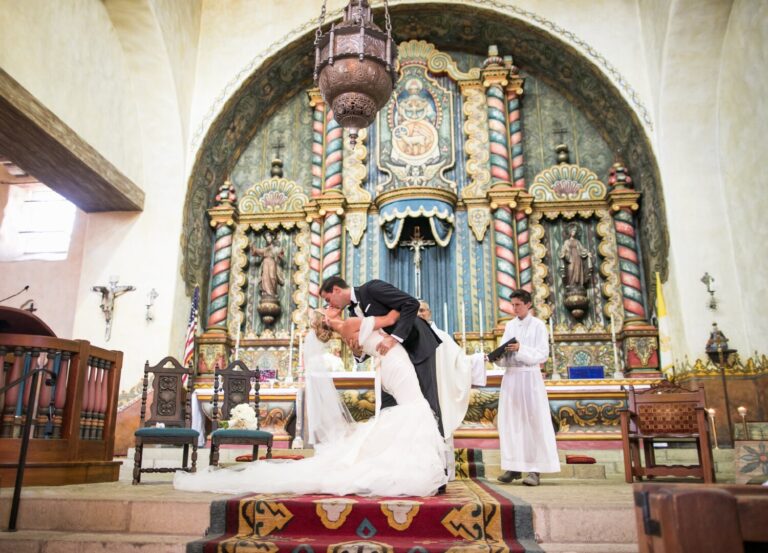 Couple at an ornate gilded chapel altar during the ceremony, Samuel Lippke Studios