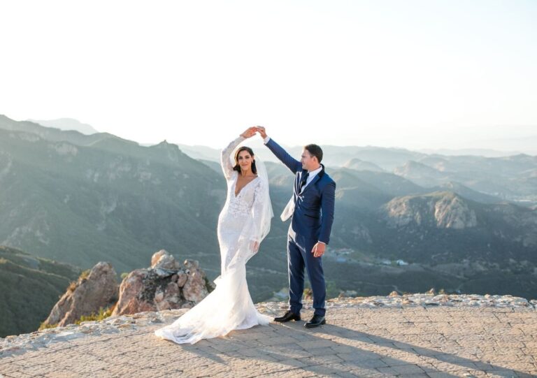 Couple dancing on a rocky mountain overlook at golden hour, Samuel Lippke Studios