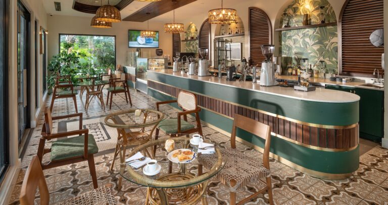 A cafe with a green counter, coffee machines and tiled floor, Sandals Dunn's River