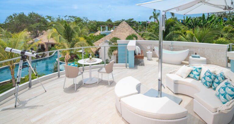 A rooftop terrace with a telescope, lounge seating and a soaking tub, Sandals Dunn's River
