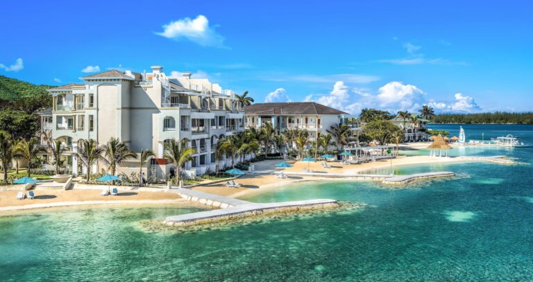 Resort buildings behind a sandy beach and shallow lagoon on the north coast of Jamaica, Sandals Royal Caribbean Resort and Private Island